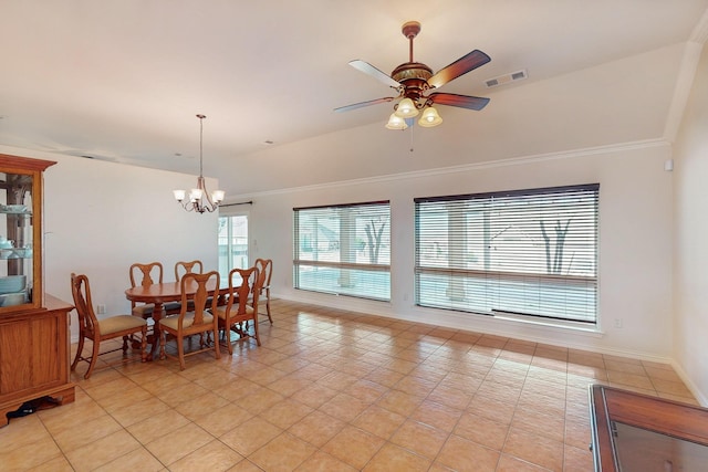 dining area with visible vents, baseboards, lofted ceiling, ceiling fan with notable chandelier, and light tile patterned flooring