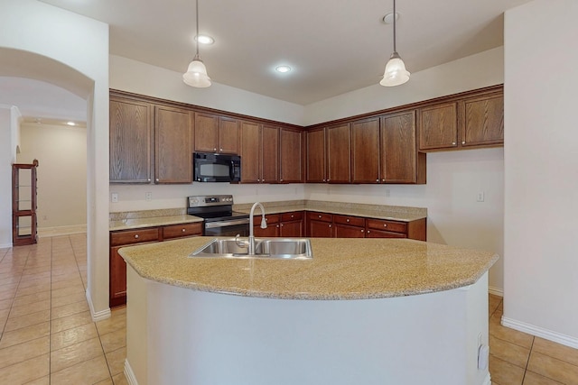 kitchen with arched walkways, stainless steel range with electric cooktop, a sink, black microwave, and decorative light fixtures