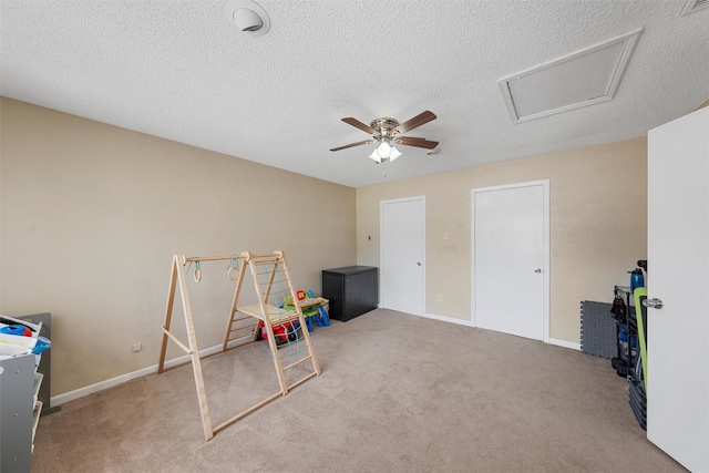 game room with baseboards, carpet floors, a textured ceiling, and a ceiling fan