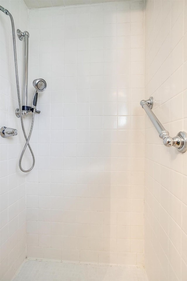 bathroom with a tile shower