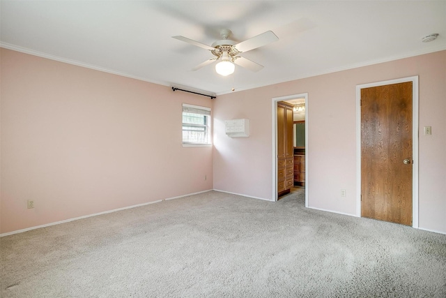 unfurnished bedroom with crown molding, carpet, baseboards, and ceiling fan