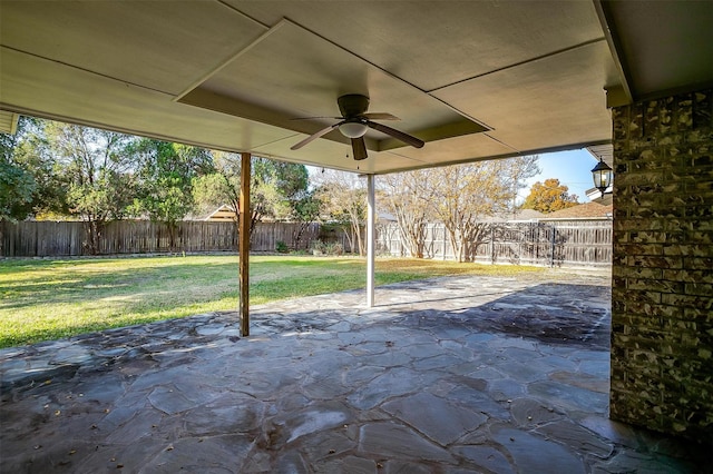 view of patio with a fenced backyard and a ceiling fan