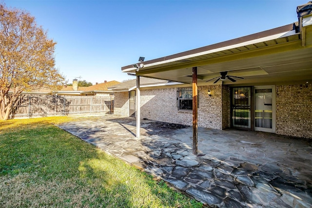 view of yard with a ceiling fan, a patio area, and fence