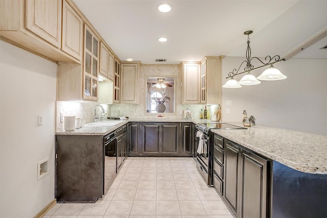 kitchen featuring backsplash, electric range, visible vents, and black dishwasher