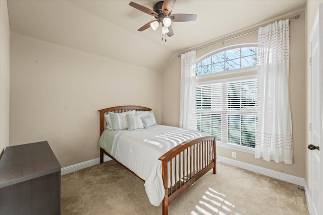 bedroom featuring baseboards, carpet, a ceiling fan, and vaulted ceiling