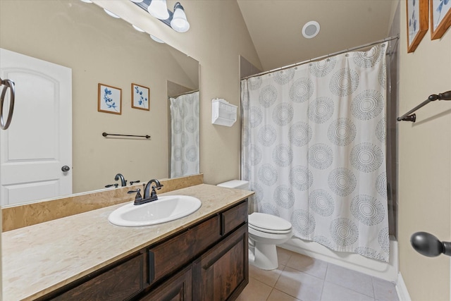 bathroom featuring vanity, tile patterned floors, toilet, and lofted ceiling