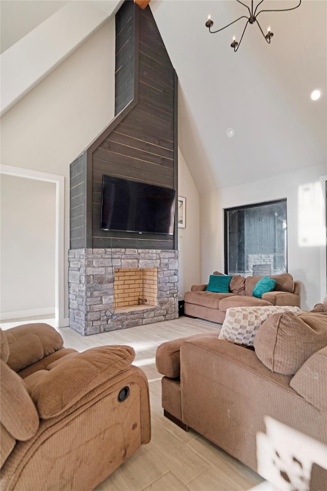 living room with an inviting chandelier and vaulted ceiling