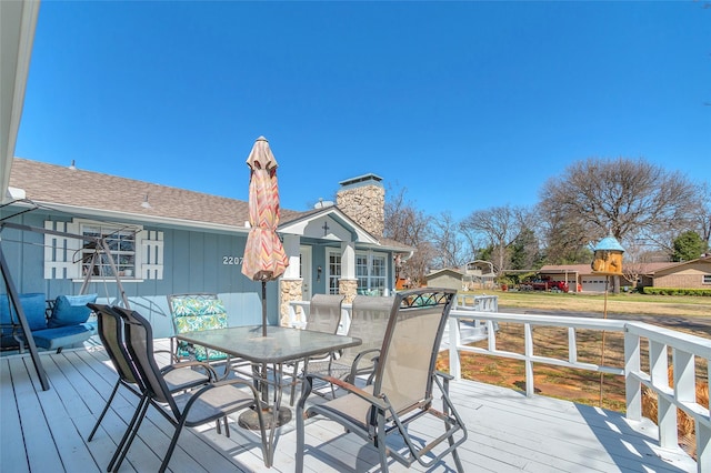 wooden deck with outdoor dining space