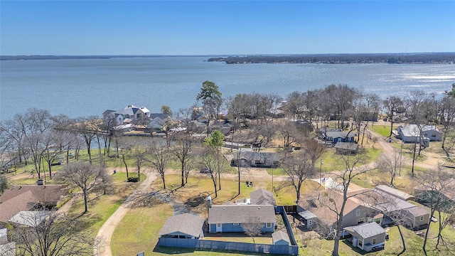 drone / aerial view featuring a water view and a residential view