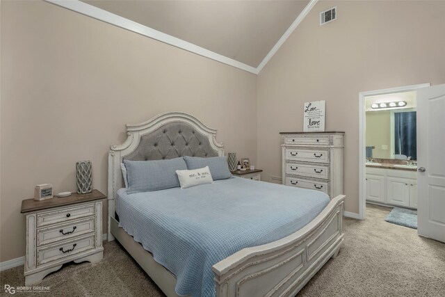 bedroom featuring baseboards, lofted ceiling, ornamental molding, light carpet, and a sink