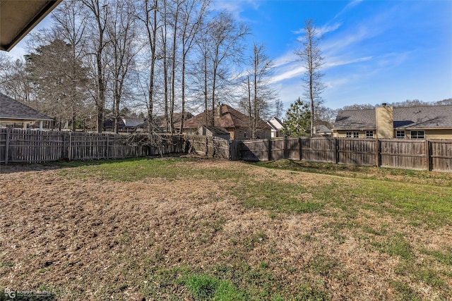 view of yard featuring a fenced backyard