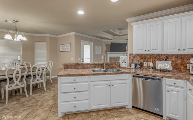 kitchen featuring ornamental molding, a sink, stainless steel dishwasher, white cabinetry, and a peninsula