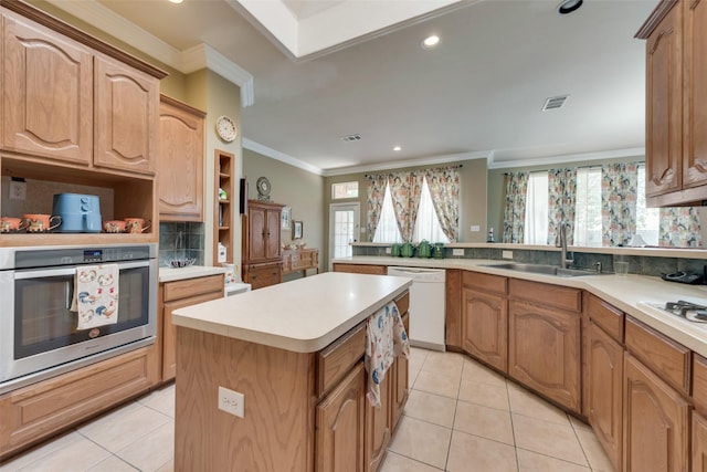 kitchen with open shelves, a sink, dishwasher, stainless steel oven, and a center island