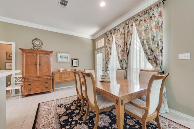 dining area with visible vents, ornamental molding, and light tile patterned flooring