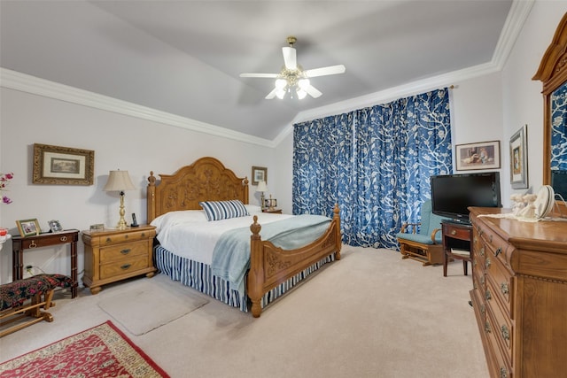 carpeted bedroom with vaulted ceiling, a ceiling fan, and ornamental molding