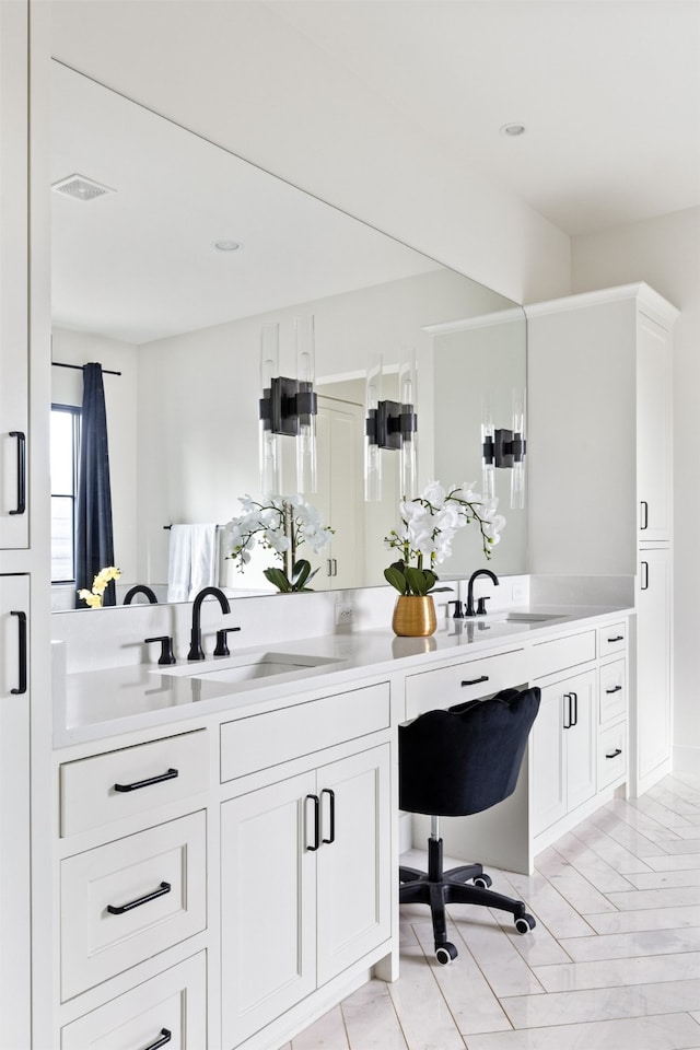 full bath with double vanity, visible vents, and a sink