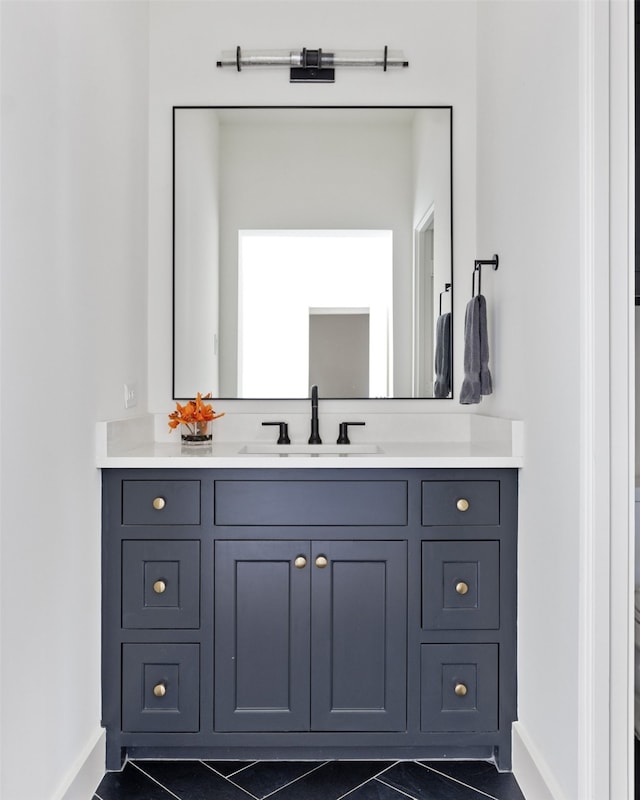 bathroom featuring vanity and baseboards