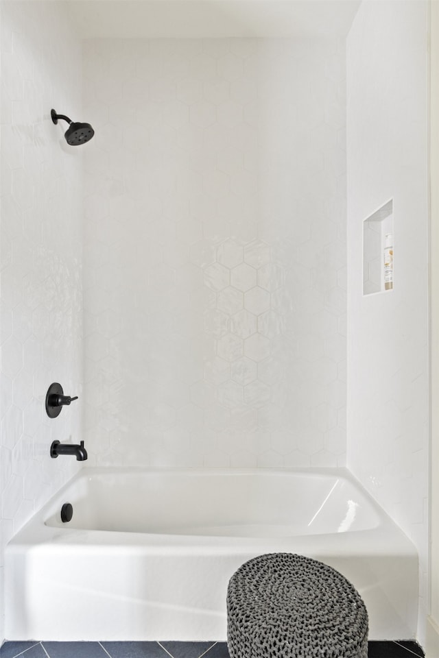 full bath featuring tile patterned flooring and shower / bath combination