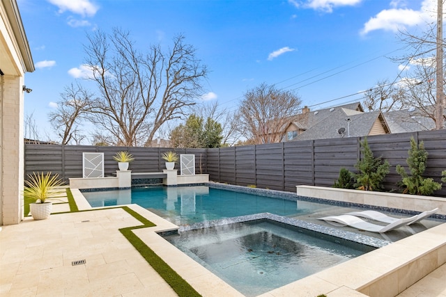 view of swimming pool with an in ground hot tub, a fenced backyard, a fenced in pool, and a patio