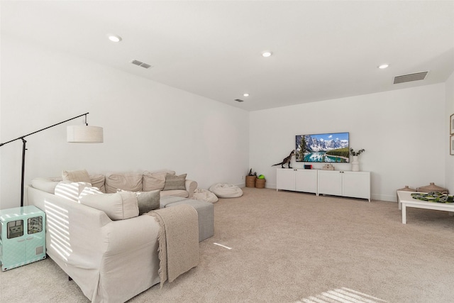 living area with light carpet, visible vents, recessed lighting, and baseboards