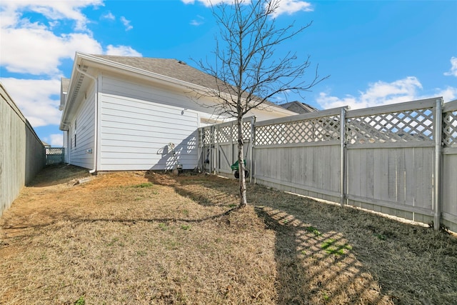 view of yard with a fenced backyard