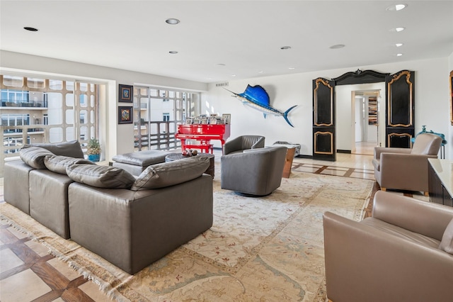 living room featuring recessed lighting and visible vents