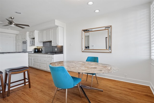 dining space featuring recessed lighting, baseboards, light wood-type flooring, and ceiling fan