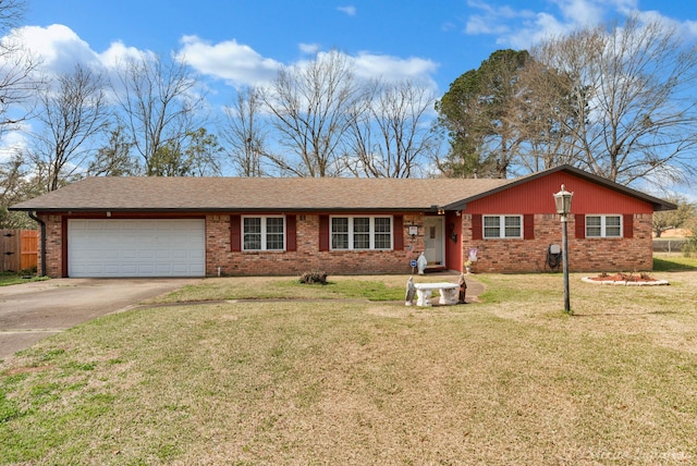 ranch-style home with a front yard, concrete driveway, brick siding, and a garage