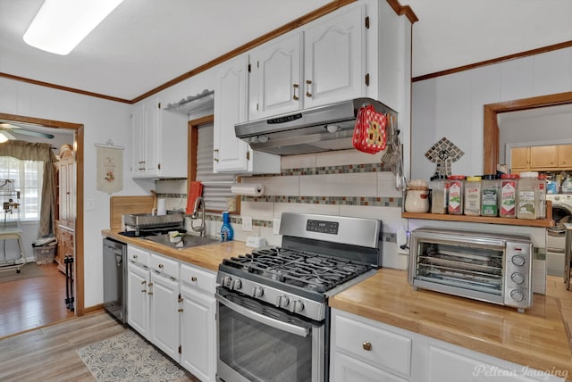 kitchen featuring under cabinet range hood, a toaster, white cabinets, and stainless steel appliances