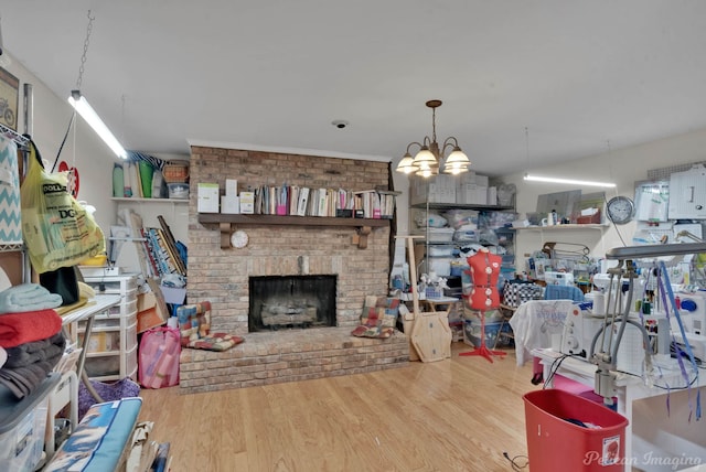 living area featuring a brick fireplace and wood finished floors