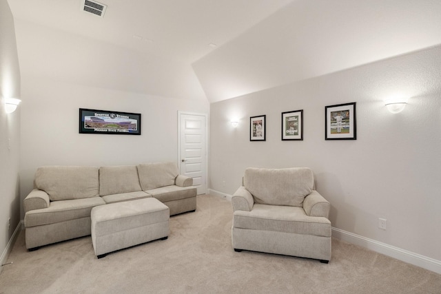 living room with visible vents, lofted ceiling, light colored carpet, and baseboards