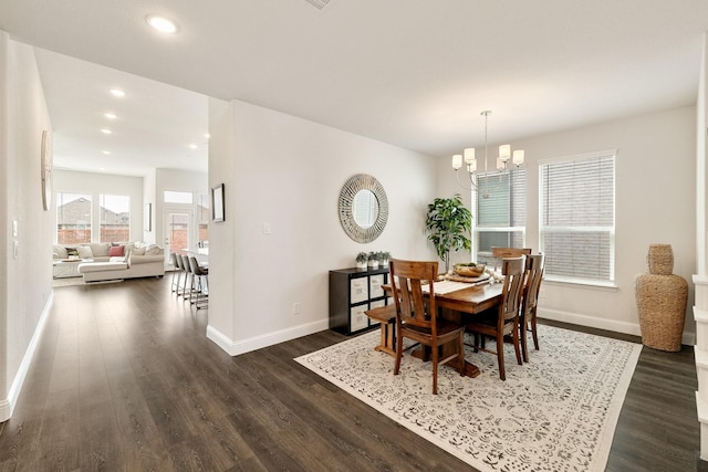 dining room with recessed lighting, a notable chandelier, baseboards, and dark wood-style flooring