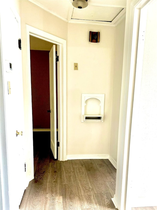 hallway with baseboards and wood finished floors