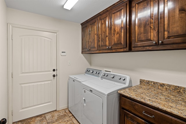 laundry room with washer and dryer and cabinet space