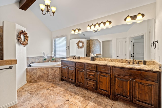 bathroom featuring a garden tub, lofted ceiling with beams, a sink, an inviting chandelier, and double vanity