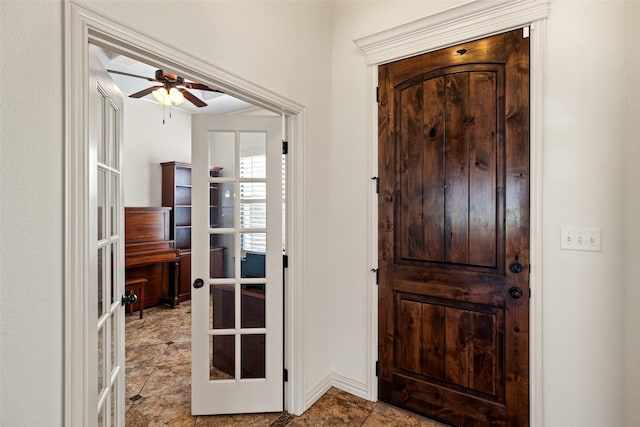 entryway with french doors and ceiling fan