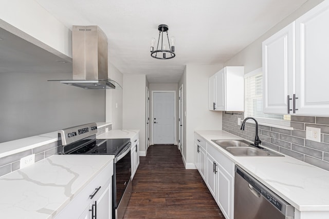 kitchen with dark wood-type flooring, island exhaust hood, a sink, backsplash, and appliances with stainless steel finishes