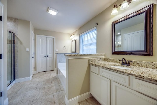 bathroom with vanity, baseboards, a shower stall, tile patterned floors, and a bath