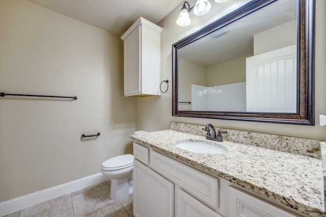 full bathroom featuring tile patterned flooring, toilet, vanity, and baseboards