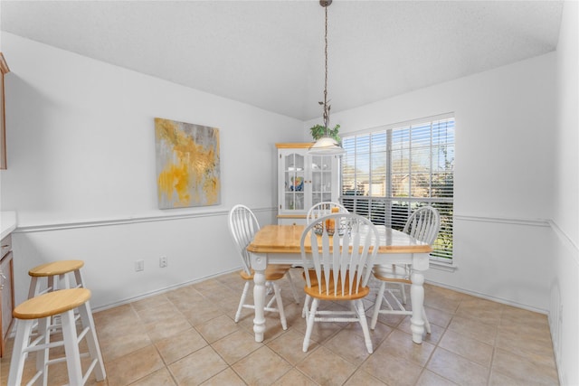 dining space with light tile patterned floors