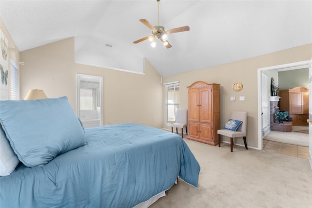 bedroom with visible vents, light colored carpet, ceiling fan, and vaulted ceiling