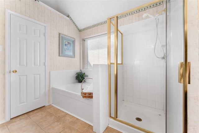 bathroom with tile patterned floors, a shower stall, wallpapered walls, and a garden tub