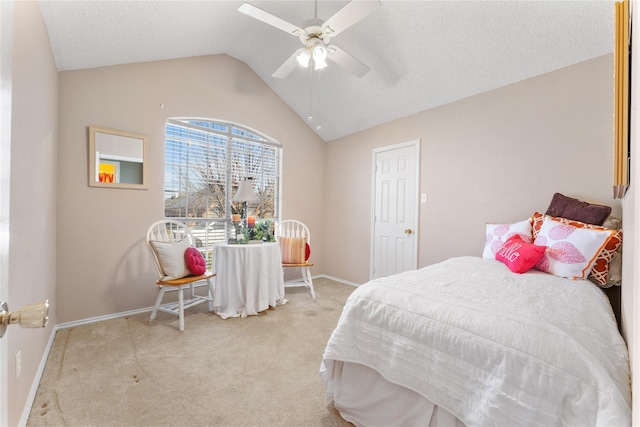 bedroom with a ceiling fan, a textured ceiling, carpet floors, baseboards, and vaulted ceiling