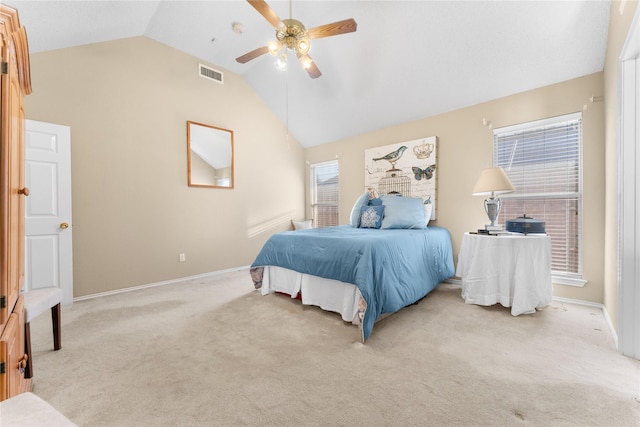 bedroom featuring a ceiling fan, visible vents, baseboards, vaulted ceiling, and light colored carpet