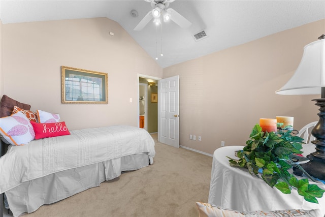 carpeted bedroom with visible vents, a ceiling fan, and vaulted ceiling