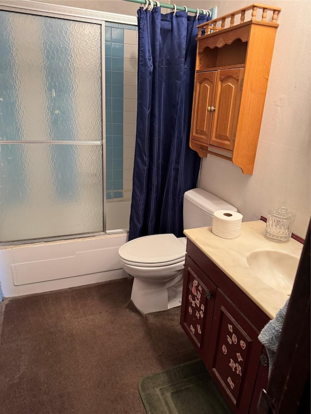 full bathroom with toilet, vanity, and bath / shower combo with glass door