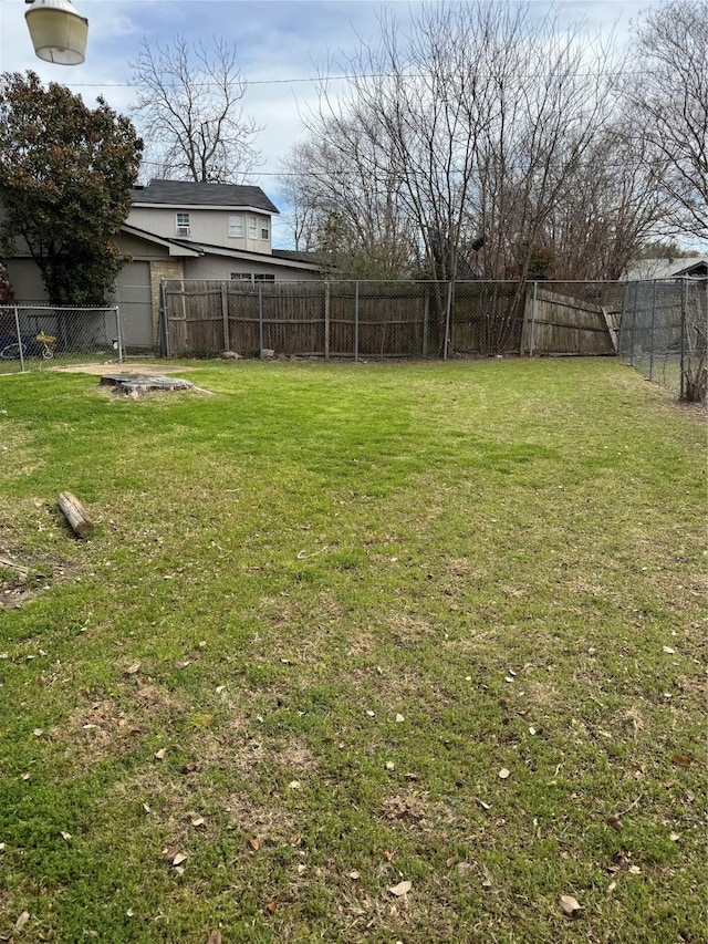 view of yard with a fenced backyard