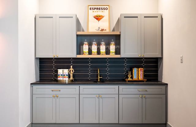 bar with indoor wet bar and tasteful backsplash