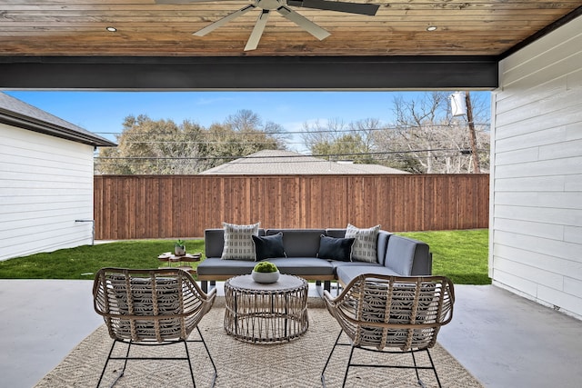 view of patio / terrace featuring an outdoor living space, a fenced backyard, and a ceiling fan