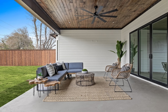 view of patio with outdoor lounge area, a ceiling fan, and fence